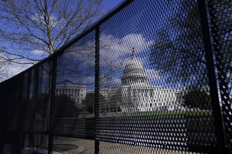 The U.S. Capitol is seen behind security fencing after a car crashed into a barrier on Capitol Hill in Washington on Friday.

