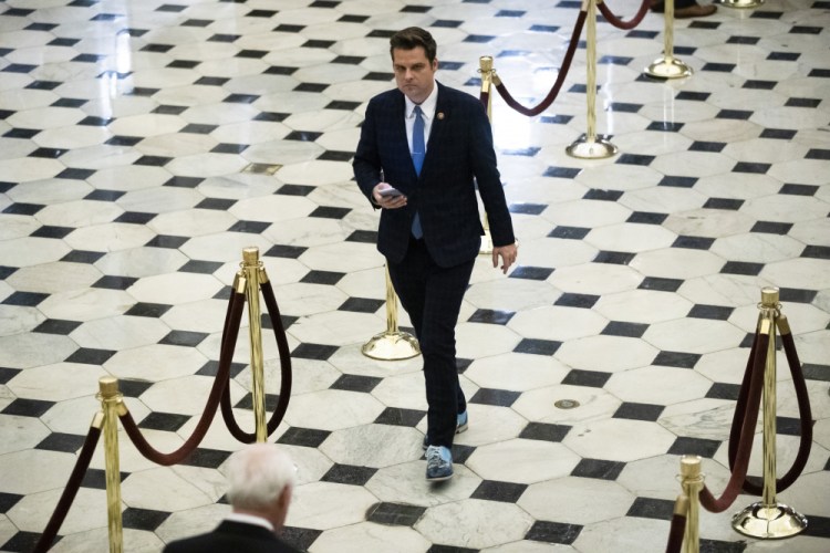 Rep. Matt Gaetz, R-Fla., walks off the House floor Dec. 18 as House of Representatives take up articles of impeachment against then-President Donald Trump on Capitol Hill in Washington.