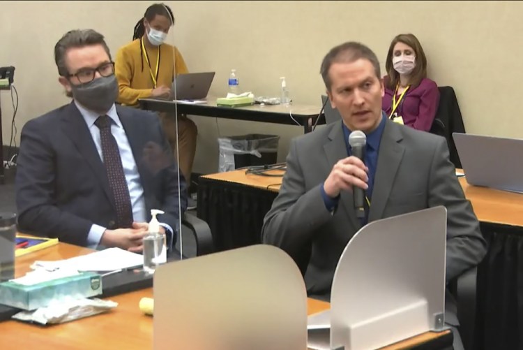 In this image from video, defense attorney Eric Nelson, left, and defendant, former Minneapolis police officer Derek Chauvin address Hennepin County Judge Peter Cahill during motions on April 15. 