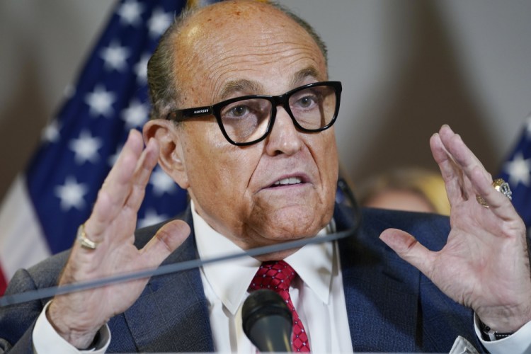 Former New York Mayor Rudy Giuliani speaks during a news conference at the Republican National Committee headquarters in Washington in November 2020. Federal agents raided Giuliani’s Manhattan home and office on Wednesday, April 28, seizing computers and cellphones in a major escalation of the Justice Department’s investigation into the business dealings of former President Donald Trump’s personal lawyer. 