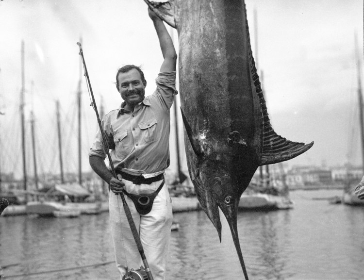 Ernest Hemingway poses with a marlin at Havana Harbor, in Key West, Fla., in July 1934. A new three-part documentary about Hemingway, which relied heavily on the archives at the John F. Kennedy Presidential Library and Museum in Boston, debuts April 5 on PBS. 