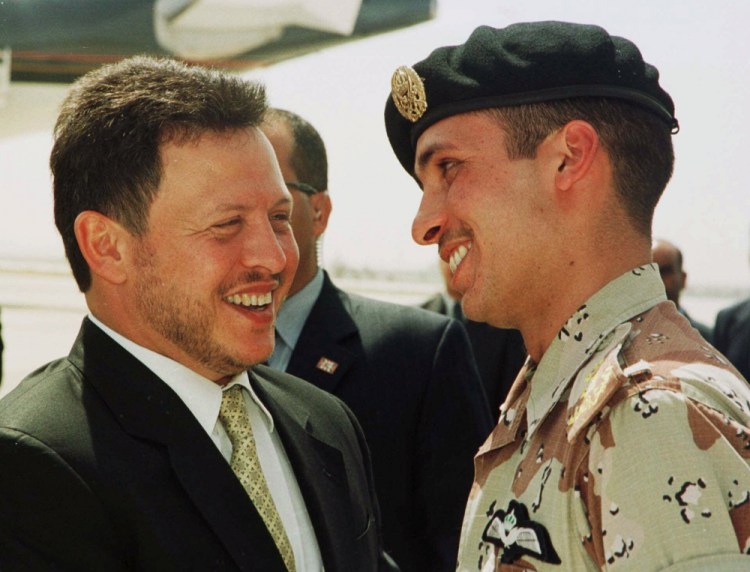 Jordan’s King Abdullah II and his half brother Prince Hamzah, right, shortly before the monarch embarked on a tour of the United States in 2001. After mediation Monday, Prince Hamzah signed a statement saying he was "at the disposal of His Majesty the King." 