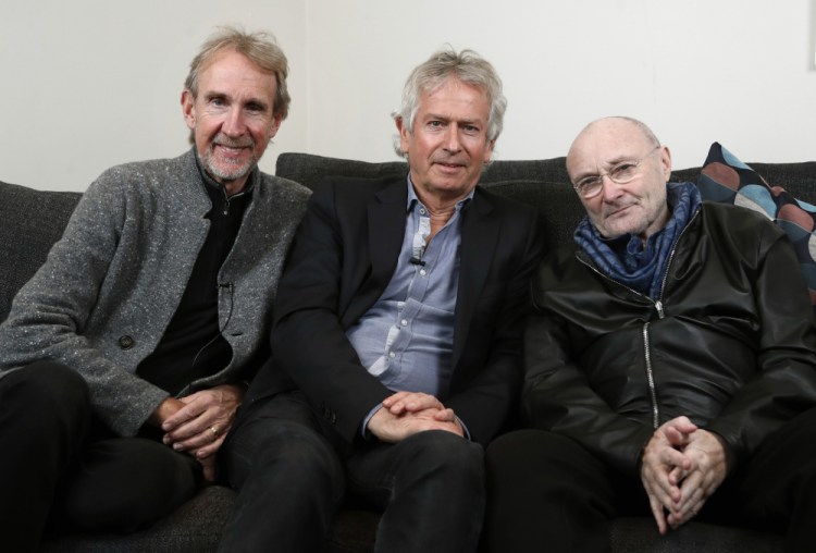 Genesis band members from left, Mike Rutherford, Tony Banks, and Phil Collins pose for a photo during an interview March 4, 2020, in London.