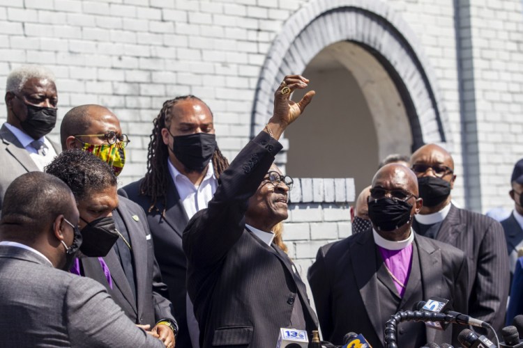 Rev. T. Anthony Spearman, president of the North Carolina NAACP, and other clergy urge state Attorney General Josh Stein to take over the investigation into the police shooting death of Andrew Brown Jr., during a news conference at the Mt. Lebanon AME Zion Church on Tuesday in Elizabeth City, N.C.