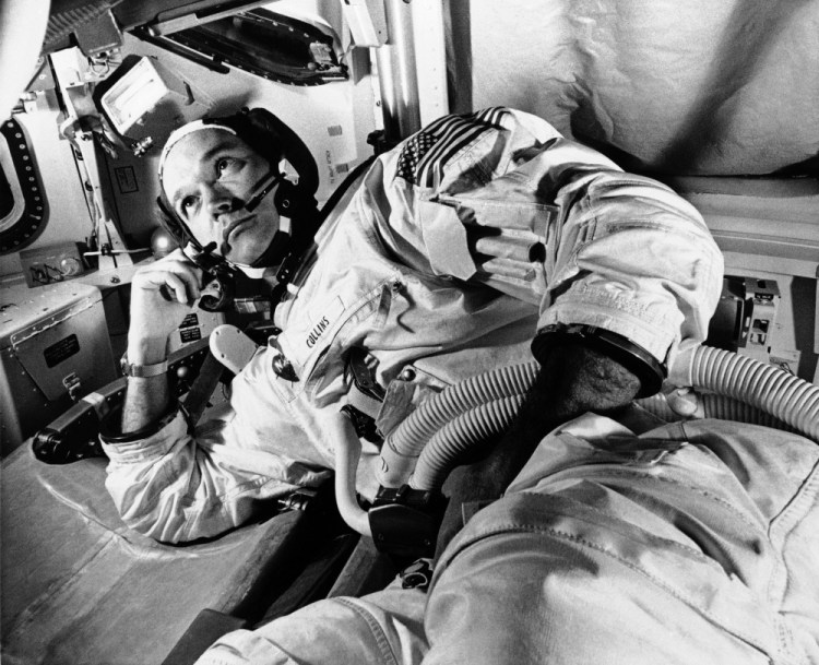 Apollo 11 command module pilot astronaut Michael Collins takes a break during training for the moon mission, in Cape Kennedy, Fla., in 1969. Collins, who piloted the ship from which Neil Armstrong and Buzz Aldrin left to make their historic first steps on the moon in 1969, died Wednesday of cancer.
