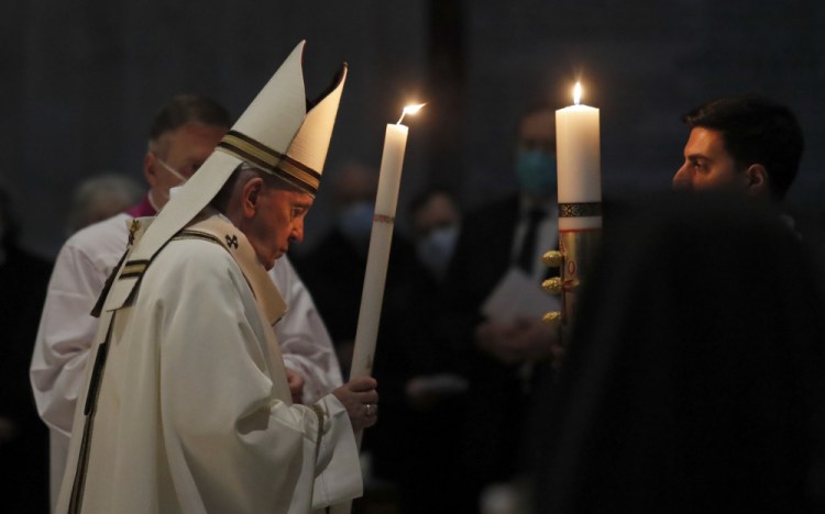 Pope Francis celebrates the Easter Vigil on Saturday in a nearly empty St. Peter's Basilica as  pandemic restrictions stay in place for a second year running, at the Vatican.

