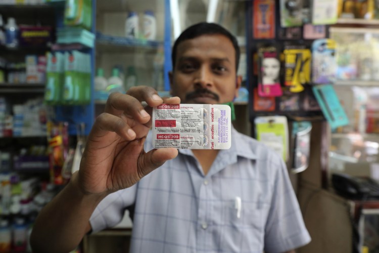 A chemist displays hydroxychloroquine tablets May 19 in Mumbai, India.