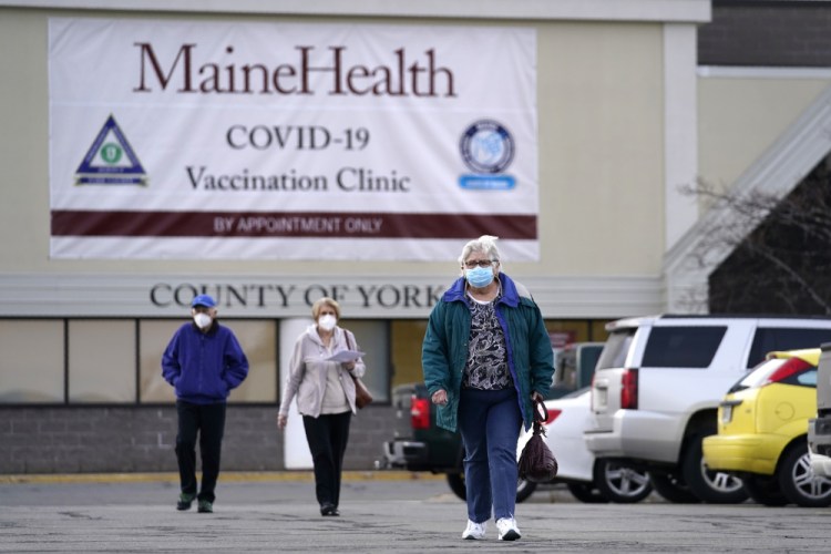 Senior citizens leave a COVID-19 vaccination site operated by Maine Health in the site of a former department store in Sanford. 
