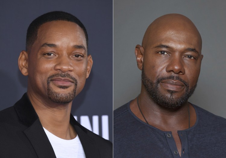 Will Smith attends the premiere of "Gemini Man" in Los Angeles on Oct. 6, 2019, left, and director Antoine Fuqua appears during a photo session in Los Angeles on July 12, 2015. Smith and director Fuqua have pulled production of their runaway slave drama “Emancipation” from Georgia over the state’s recently enacted law restricting voting access. 