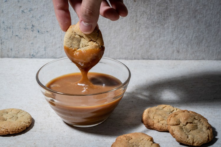 Cajeta, a caramel sauce traditionally made with goat's milk, can be drizzled over ice cream or pancakes, spread on thin cookies, and used to make tres leches cake or for dipping fruit. It is, best of all, eaten straight out of the jar with a spoon. MUST CREDIT: Photo by Scott Suchman for The Washington Post.