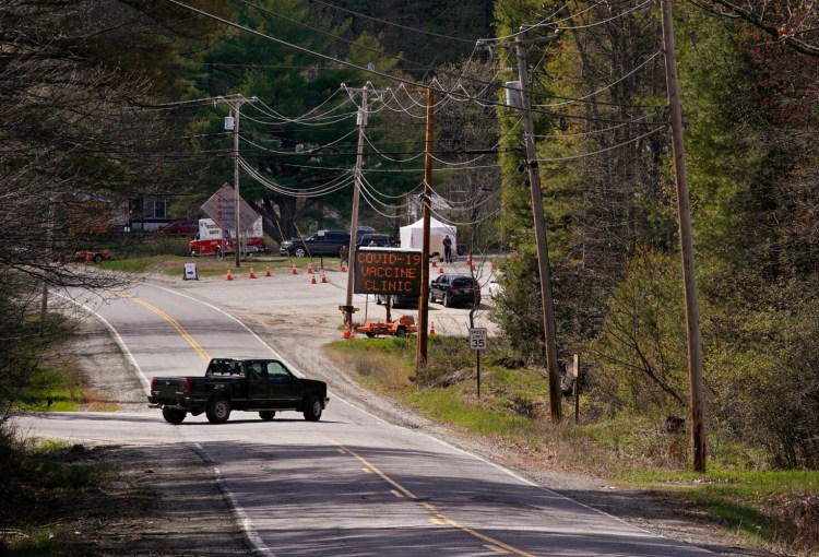 TURNER, ME - MAY 6: A truck pulls out onto Howes Corner Road in Turner on Thursday, May 6, 2021, near where a mobile vaccination clinic was set up at the Boofy Quimby Memorial Center from May 5-7. (Staff photo by Gregory Rec/Staff Photographer)