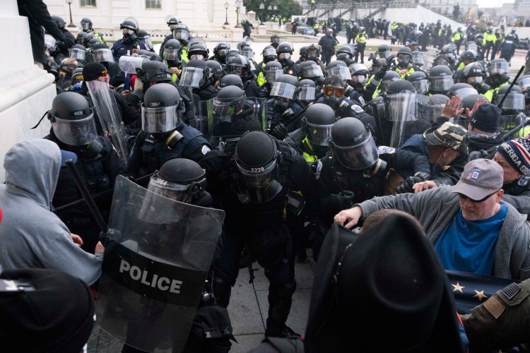 U.S. Capitol Police push back rioters on Jan. 6. 
