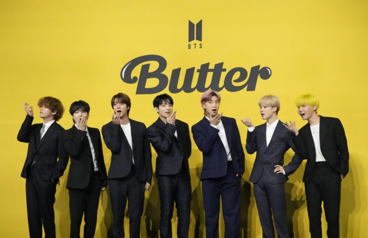 Members of South Korean K-pop band BTS pose for photographers ahead of a press conference to introduce their new single "Butter" in Seoul, South Korea, Friday, May 21, 2021. 