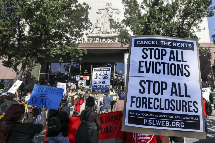 A broad coalition of tenants and housing rights organizers rally at Stanley Mosk Courthouse to protest eviction orders issued against renters in September 2020 in Los Angeles.