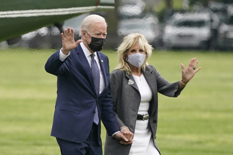 President Joe Biden and first lady Jill Biden wave after stepping off Marine One on the Ellipse near the White House, Monday, May 3, 2021, in Washington.  