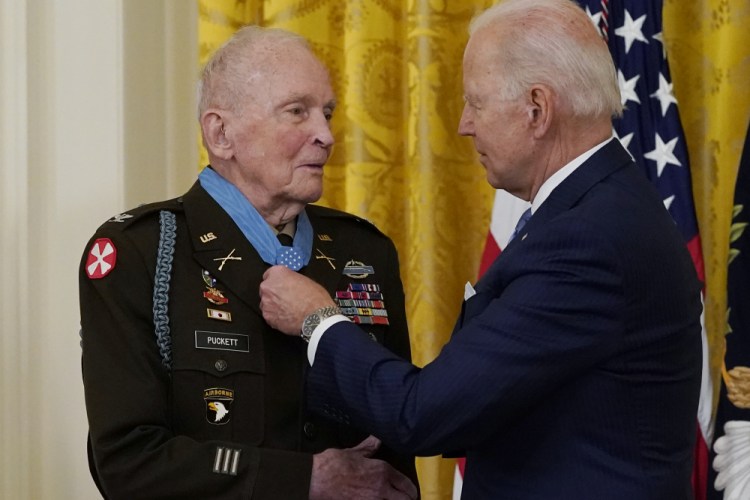 President Joe Biden speaks with retired U.S. Army Col. Ralph Puckett after he was presented the Medal of Honor, in the East Room of the White House, Friday, May 21, in Washington. 