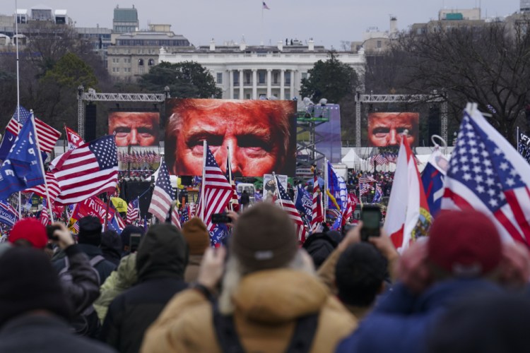Trump supporters participate in a rally in Washington on Jan. 6 that culminated in the violent breaching of the U.S. Capitol. Facebook cited the former president's comments encouraging violence in suspending his social media account for two years.