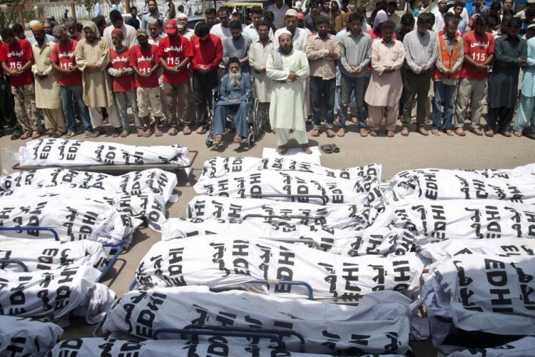 Mourners attend a funeral in 2015 for unclaimed people who died of extreme weather, in Karachi, Pakistan, after a devastating heat wave that killed 800.

 