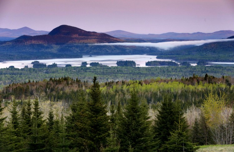 Central Maine Power's hydropower transmission corridor would be in the vicinity of this view of Attean Pond near Jackman, as seen from a scenic pullover. A 54-foot-wide swath of land would extend 53 miles from the Canadian border into Maine's north woods. 