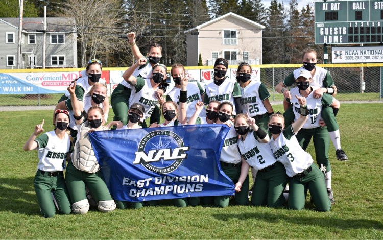 The Husson softball team celebrates after winning the North Atlantic Conference East Division title last weekend in Bangor. The Eagles, with a 25-1 record, play Cazenovia for the NAC title this weekend in New York.
