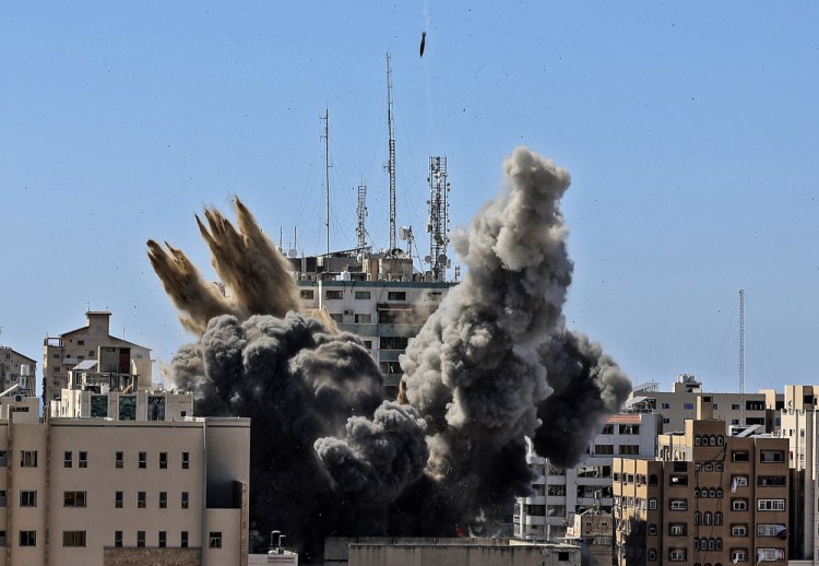 An air bomb hits the building housing various international media, including the Associated Press, in Gaza City on May 15. 

