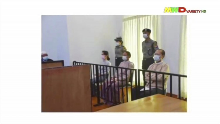 In this image from a news report shows  deposed Myanmar leader Aung San Suu Kyi, former President Win Myint, third from right, and former Naypyitaw Council chairman Dr. Myo Aung before a special court on Monday in Naypyitaw, Myanmar.  