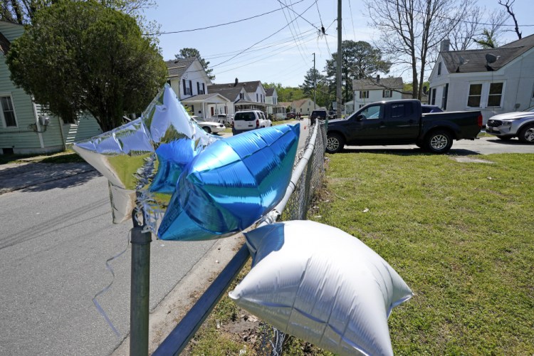 Balloons are seen tied to a fence April 22 in Elizabeth City, N.C.