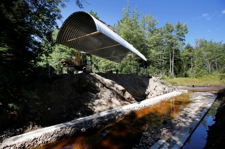 Workers install an open-bottom arch culvert on the Passadumkeag River in September 2014. A $7 million grant from the U.S. Department of Agriculture will help restore some of Maine’s highest-value aquatic networks from fragmentation and degradation by improving roadway stream crossings.