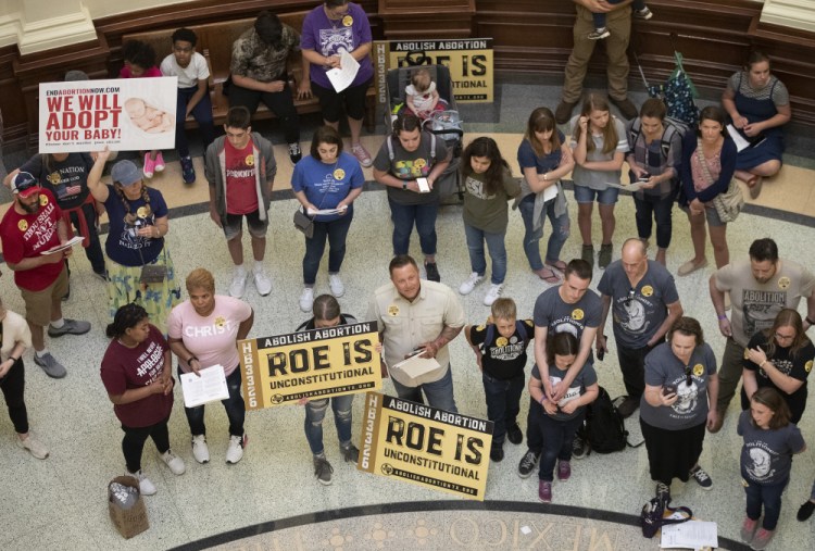 ro-life demonstrators gather in the rotunda at the Capitol while the Senate debated anti-abortion bills in Austin, Texas on March 30, 2021. Texas has become the largest state with a law that that bans abortions before many women even know they are pregnant. 