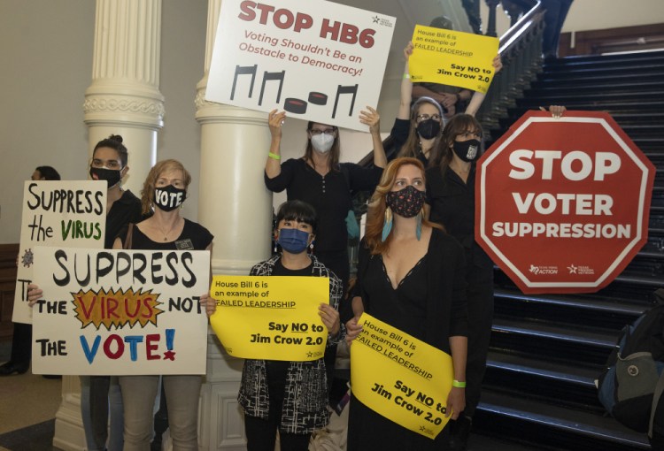 People gather outside the House Chamber at the Capitol in Austin on Thursday May 6, to protest House Bill 6, a bill that would create new election-related crimes, boost penalties for existing crimes and raise the profile of partisan poll watchers. 