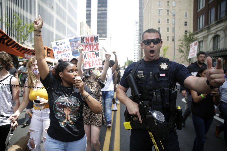 A Tulsa police officer works near a Black Lives Matter event on June 20. 

