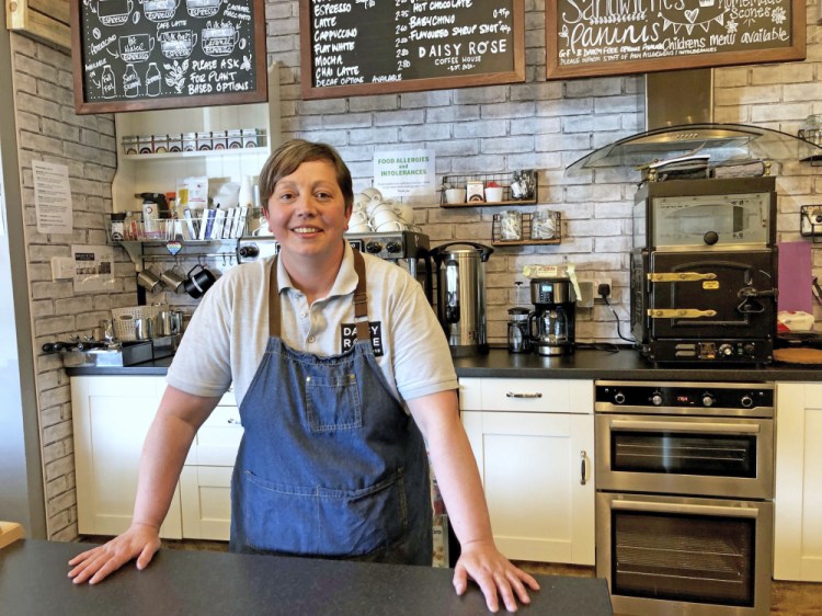 Caroline Atkinson, owner of the Rose Coffee House, prepares to reopen, in Belmont, Durham, England. On Monday, people in England will be able to eat a restaurant meal indoors, drink inside a pub and visit one another’s homes for the first time in months. 