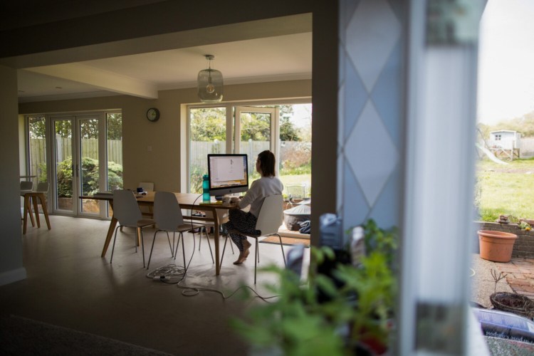 Experts are concerned the future mix of home and office work will be complicated to manage. MUST CREDIT: Bloomberg photo by Chris Ratcliffe