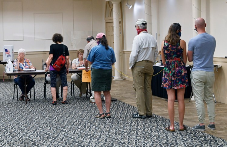 PORTLAND, ME - JUNE 8:  A line of people waiting to vote for the charter commission election at Italian Heritage Center in Portland Tuesday, June 8, 2021. (Staff Photo by Shawn Patrick Ouellette/Staff Photographer)