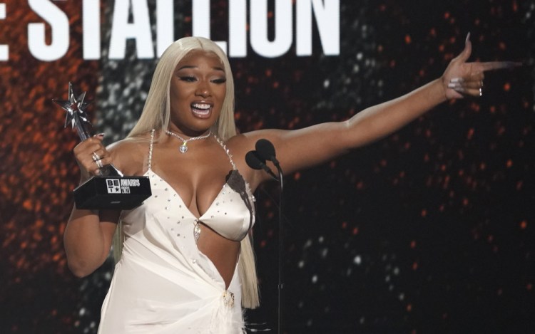 Megan Thee Stallion accepts the best female hip hop artist award at the BET Awards on Sunday at the Microsoft Theater in Los Angeles.