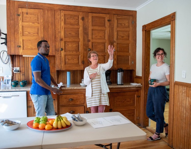 Ahmed Alasow, left, gets a tour in June during an open house for a new program called Renter 2 Owner in Lewiston. Building owner and president of Healthy Homeworks, Amy Smith, center, and her daughter, Allie Smith, chairwoman of the Lewiston Housing Committee, started the program to create more pathways to home ownership. The program just wrapped up its first session of a first-time homebuyers class.