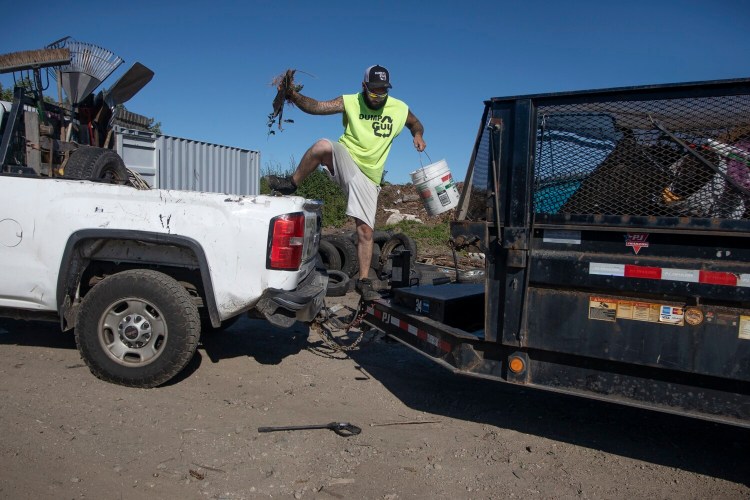 SCARBOROUGH, ME - JUNE 24: Phil Smith recently took a job at The Dump Guy because he wasn’t getting enough hours at his previous positiion. He received a hiring bonus and the job includes benefits, all which help because he has three kids. (Staff photo by Derek Davis/Staff Photographer)