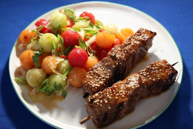 BRUNSWICK, ME - JUNE 24: Sweet and Hot Tuna Skewers and Melon Salad -- watermelon, honeydew and cantaloupe in a dressing of lime juice, fish sauce, soy sauce, honey and chopped Fresno chilis. (Staff photo by Ben McCanna/Staff Photographer)