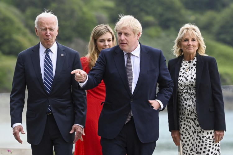 President Joe Biden, Carrie Johnson, Britain's Prime Minister Boris Johnson and first lady Jill Biden walk outside Carbis Bay Hotel in Cornwall, Britain, on Thursday. 