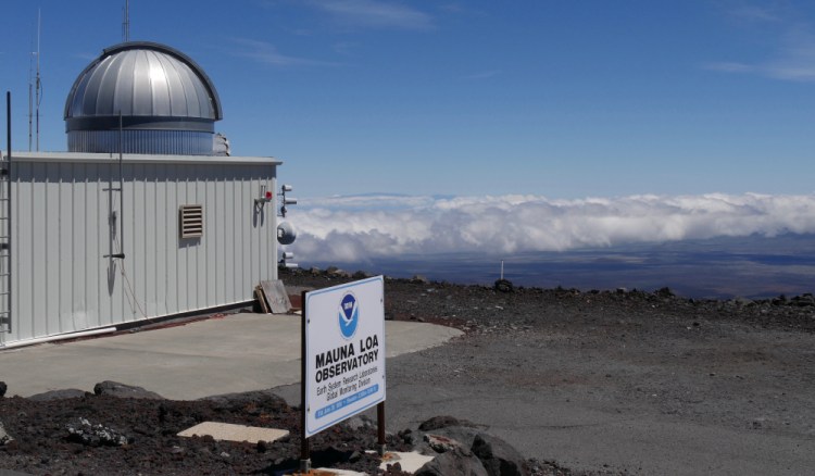 The Mauna Loa Atmospheric Baseline Observatory, shown in 2019, is located high atop Hawaii's largest mountain in order to sample well-mixed background air free of local pollution. Heat-trapping carbon dioxide levels in the air peaked in May 2021, in amounts nearly 50 percent higher than when the industrial age began and they are growing at a record fast rate, scientists reported Monday.