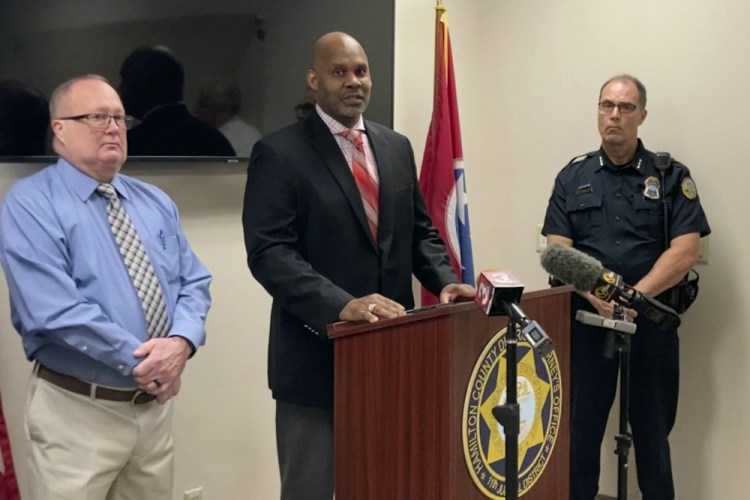 Saadiq Pettyjohn, center, son of Samuel Pettyjohn, speaks at a news conference on Wednesday in Chattanooga, Tenn. Law enforcement officials announced the closing of a 42-year-old cold case of Samuel Pettyjohn, a Chattanooga businessman who was shot and killed in 1979 in a contract killing that former Gov. Ray Blanton's administration helped pay for. 