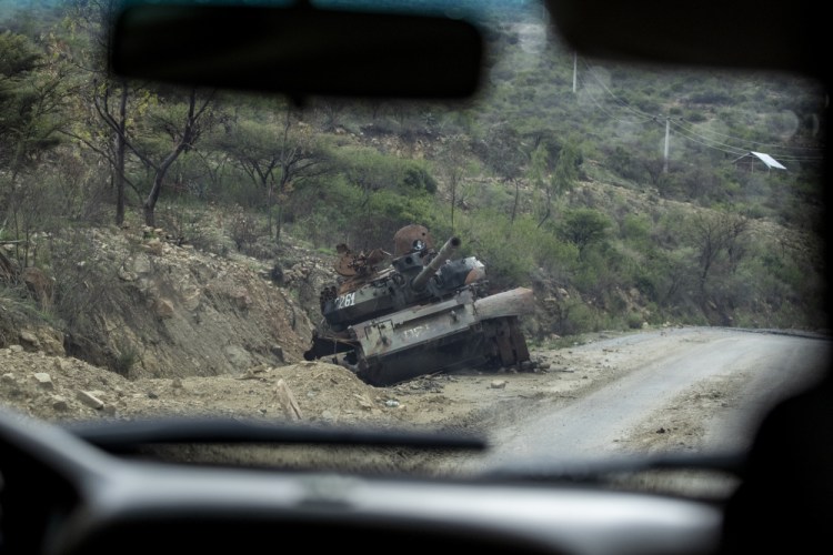 A destroyed tank sits by the side of a road leading to Abi Adi in the Tigray region of northern Ethiopia on May 11. 