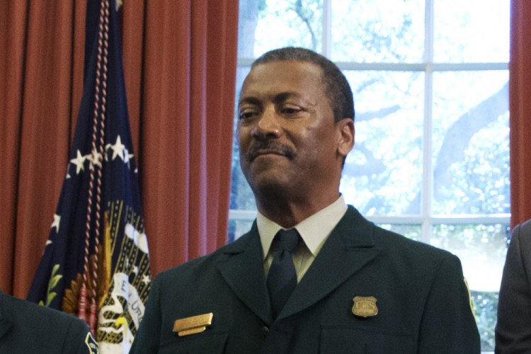 Randy Moore, of the U.S. Forest Service, listens as President Barack Obama talks about the designation of three new national monuments in the Oval Office of the White House in Washington, in July 2015. Moore has been named chief of the U.S. Forest Service, the first Black person to lead the agency in its 116-year history. 