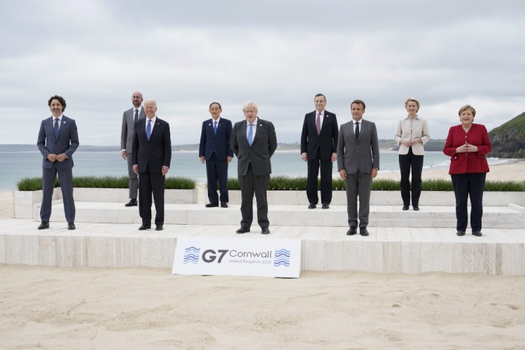 Leaders of the G7 pose for a group photo on overlooking the beach at the Carbis Bay Hotel in Carbis Bay, St. Ives, Cornwall, England, Friday, June 11. Leaders from left, Canadian Prime Minister Justin Trudeau, European Council President Charles Michel, U.S. President Joe Biden, Japan's Prime Minister Yoshihide Suga, British Prime Minister Boris Johnson, Italy's Prime Minister Mario Draghi, French President Emmanuel Macron, European Commission President Ursula von der Leyen and German Chancellor Angela Merkel. 