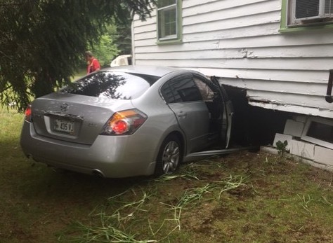 A car struck a house at the intersection of Main Street and Jellerson Road in the Town of Waterboro.