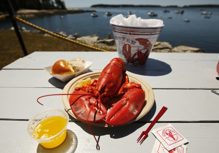 A lobster is served on the waterfront at McLoon's Lobster Shack in Spruce Head in 2018.