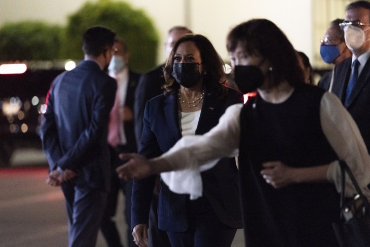 Vice President Kamala Harris, center, walks to her motorcade, Monday, June 7, 2021, at Benito Juarez International Airport, in Mexico City, after arriving from Guatemala. 
