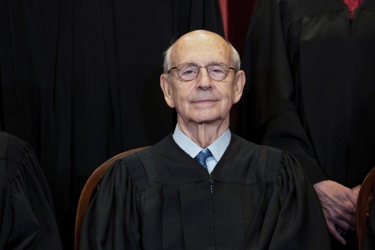 Supreme Court Associate Justice Stephen Breyer sits during a group photo at the Supreme Court in Washington in April 2021.  