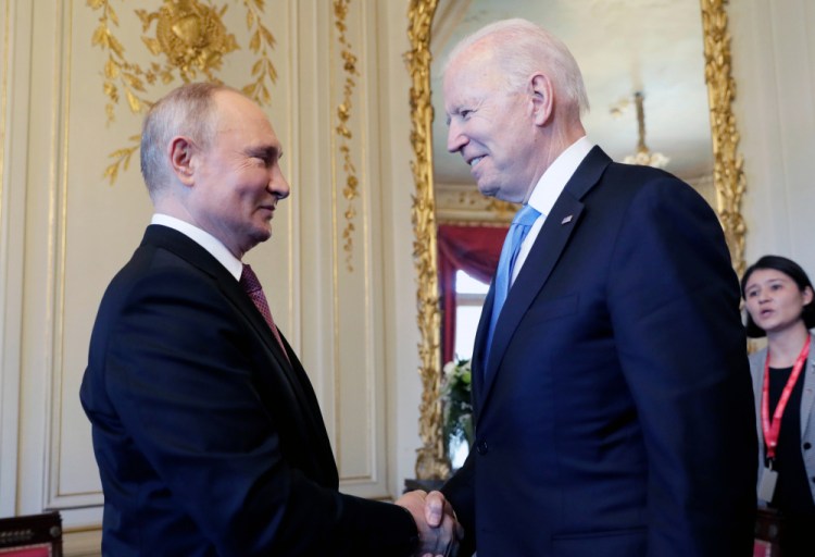 President Biden and Russian President Vladimir Putin shake hands during their meeting in Geneva, Switzerland, on Wednesday.
