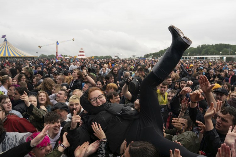 A festivalgoer crowd-surfs on the first day of Download Festival at Donington Park at Castle Donington, England, on Friday.